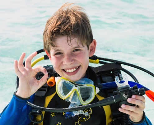 Young diver laughing